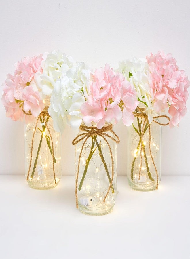 چوينت مجموعة من 4 مرطبانات زجاجية مزينة بإضاءة LED على شكل زهور الكوبية باللونين الوردي والأبيض، مثالية لتزيين الطاولات وحفلات الزفاف والمناسبات الأخرى. - Image 1
