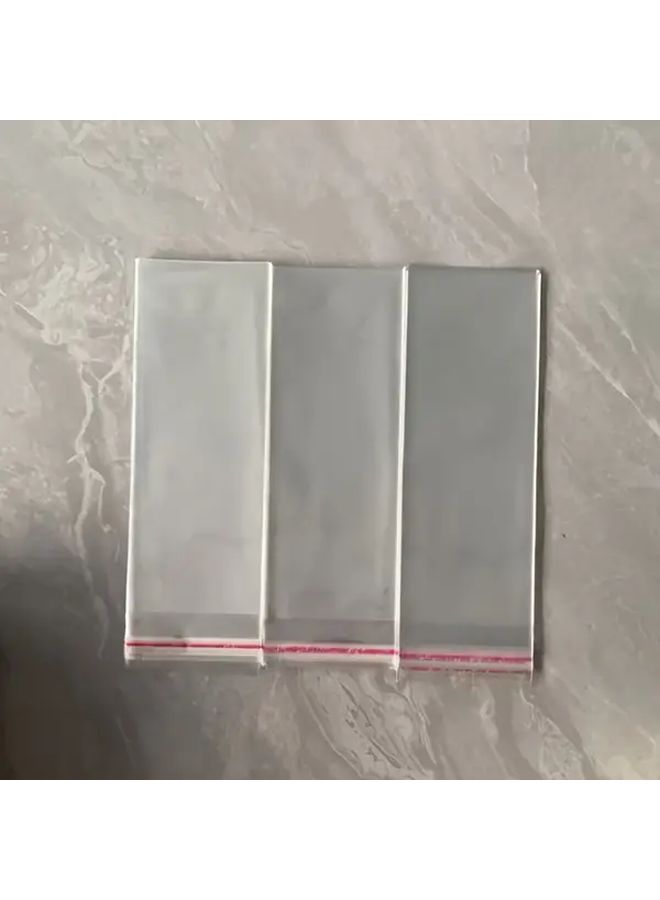 100 كيس بلاستيكي شفاف من OPP مقاس 21x8 سم مع إغلاق رباط قابل لإعادة الاستخدام لتغليف المجوهرات - Image 1