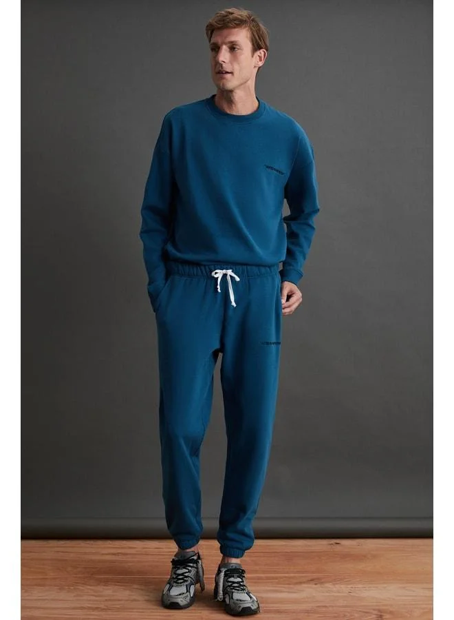 GRIMELANGE Marshall Men's Cotton Fleece-Lined Embroidered Relaxed Petrol Green Tracksuit.