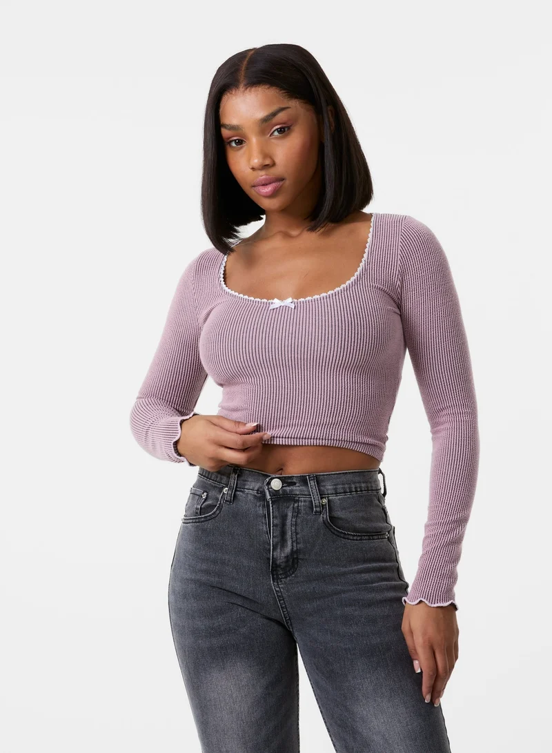 بينك فانيلا بلوزة بأكمام طويلة مضلعة مع فيونكة