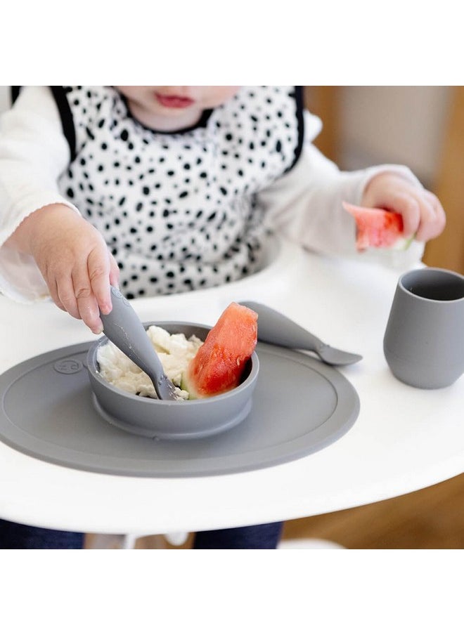 ezpz ezpz First Food Set - 100% Food Grade Silicone Suction Bowl with Built-in Placemat, Training Cup & Spoon - Designed by a Pediatric Feeding Specialist - Promotes Self Feeding - 6 Months+ (Grey)  - Image 4