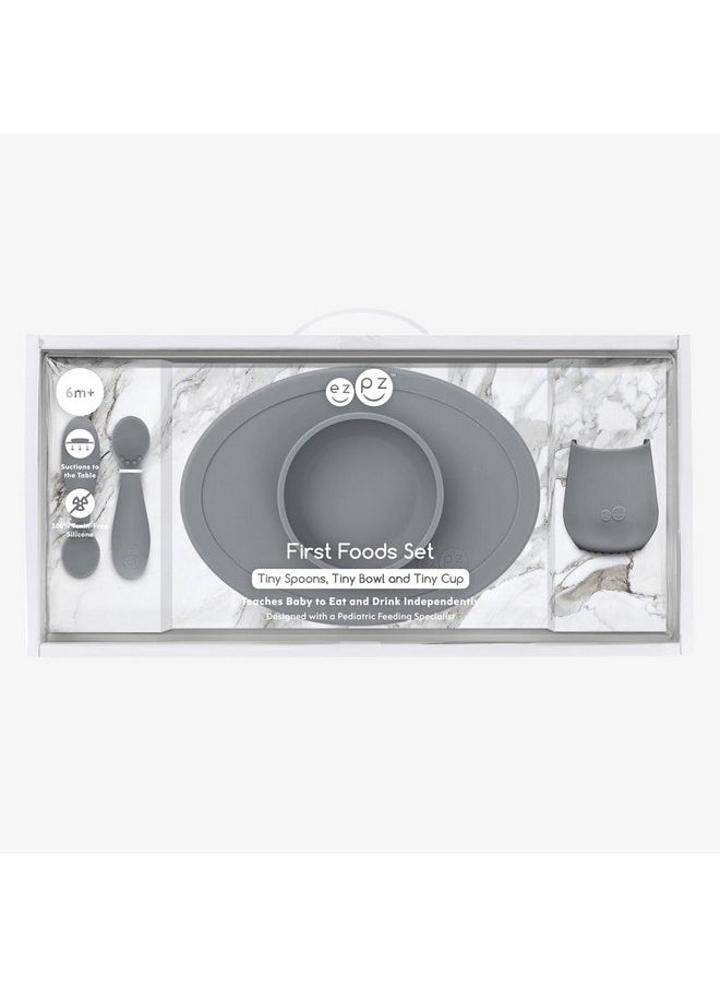 ezpz ezpz First Food Set - 100% Food Grade Silicone Suction Bowl with Built-in Placemat, Training Cup & Spoon - Designed by a Pediatric Feeding Specialist - Promotes Self Feeding - 6 Months+ (Grey)  - Image 2