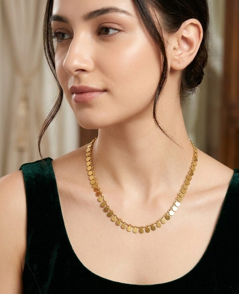 Luxuria An elegant necklace featuring a delicate chain from which hangs a collection of small, solid, round pendants with a pleasing texture; a design that combines Middle Eastern and contemporary styles. - Image 1