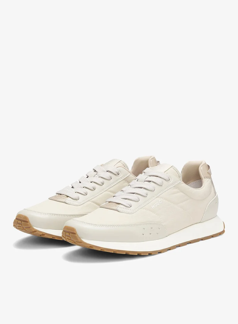 هوجو أحذية رياضية مستوحاة من الجري بتفاصيل متعرجة