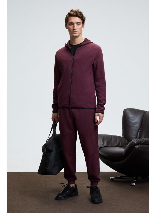 GRIMELANGE GELIDO Men's Elastic Waist Cuffed Leg Corded Karyoka Sewn Printed Maroon Sweatpants. - Image 1