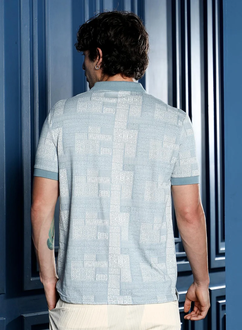 Campus Sutra Men Lattice-Geometric Jacquard Polo T-Shirt | Jacquard Polo Neck, Short Ribbed-Cuff Sleeves | Half-Button , Straight Hem | Floral Jacquard Knitted Fabric For Casual & Daily Wear | Blue