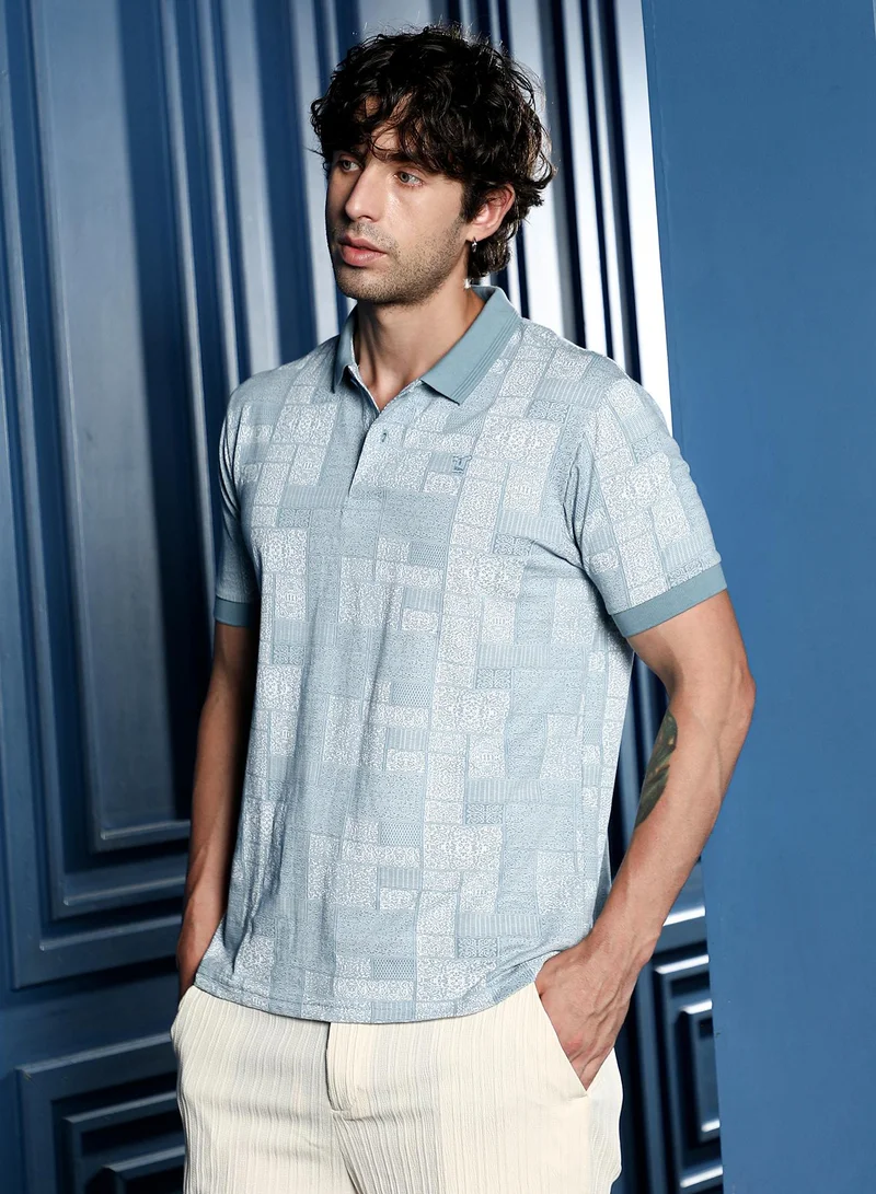 Campus Sutra Men Lattice-Geometric Jacquard Polo T-Shirt | Jacquard Polo Neck, Short Ribbed-Cuff Sleeves | Half-Button , Straight Hem | Floral Jacquard Knitted Fabric For Casual & Daily Wear | Blue