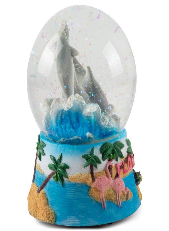 إيلانز ديزاينز تمثال دولفين فلوريدا من تصميمات إيلانز، يُوضع على الطاولة أو الخزانة أو المنضدة الجانبية، مصنوع من كرة ثلجية موسيقية متينة لامعة بقطر 100 مم، تعمل باللف المائي، وتعزف لحن "البحر الجميل". - Image 2