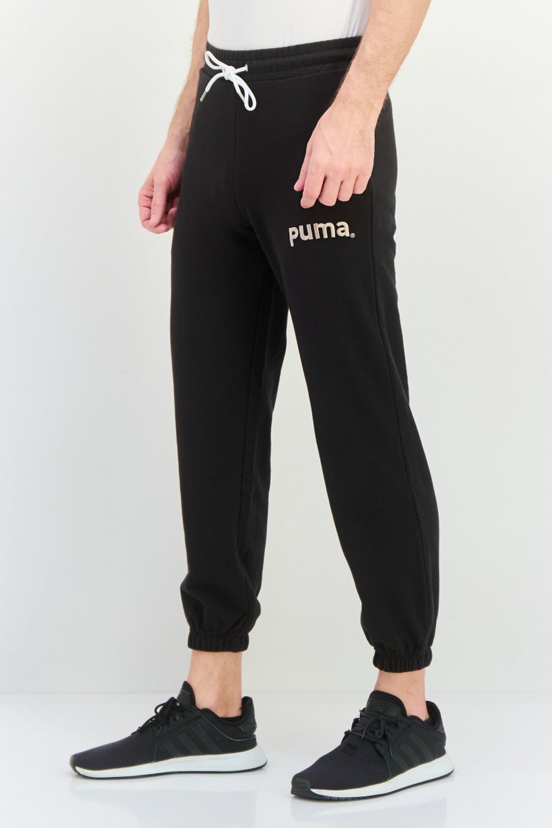 PUMA Men Relaxed Fit Outdoor Sweatpants, Black - Image 2