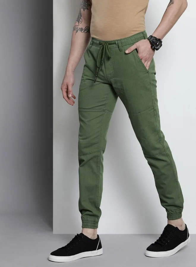 شركة المرآب الهندية Men Slim Fit Solid Mid-Rise Elasticated Linen Jogger Trouser
