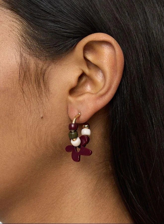 بارفوا أقراط طوقية مع زهرة في الراتنج