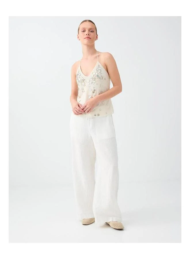 Jimmy Key Mesh Blouse with Stone Button Detail and Neck Tie.