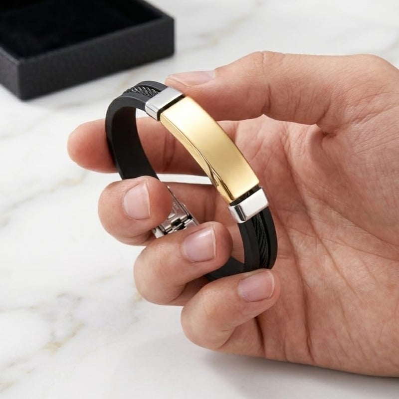 A luxurious, modern men's bracelet, combining black silicone with an artistic wire touch and a gold-colored stainless steel piece, a blend of strength and elegance for everyday wear. - Image 4