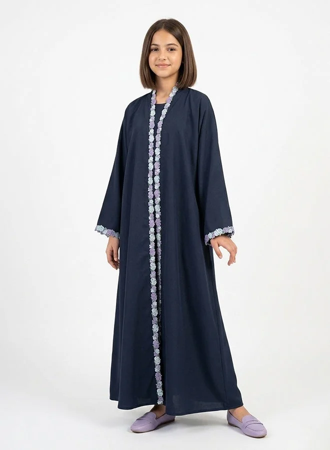 HAWRAA ABAYA Navy girls’ wrap abaya adorned with floral trim
