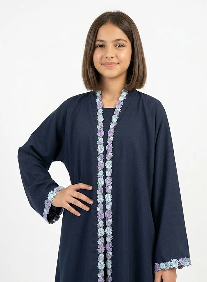 HAWRAA ABAYA Navy girls’ wrap abaya adorned with floral trim