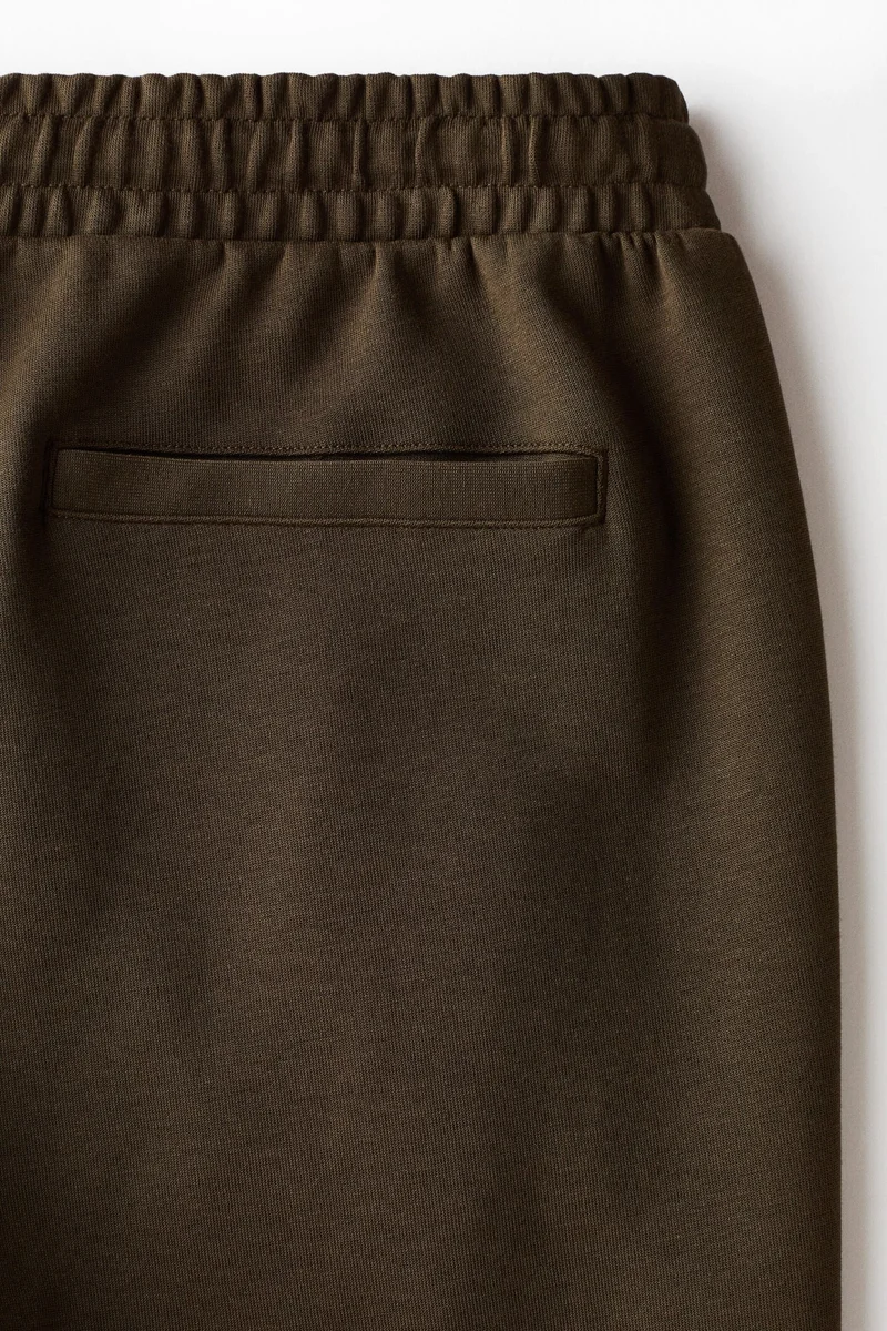 H&M  Regular Fit Interlock crease-front joggers for Men | Best Price UAE