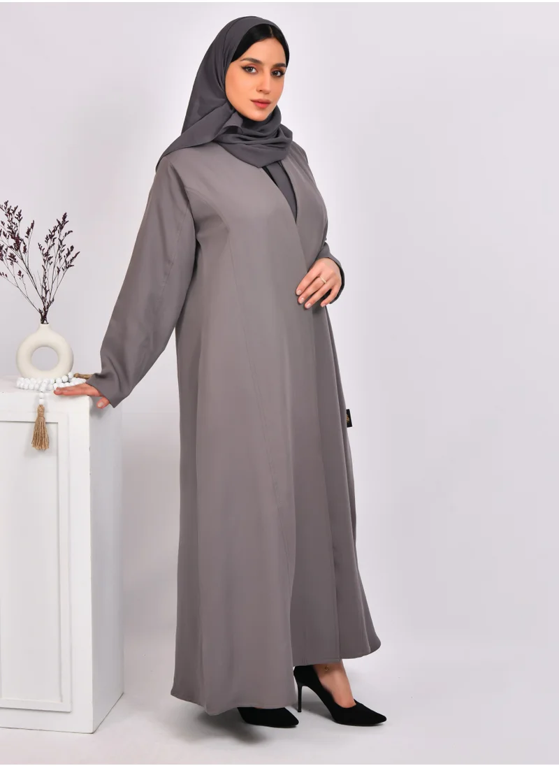 HAWRAA ABAYA Light gray quarter-length wrap abaya, distinguished by its detailed lines