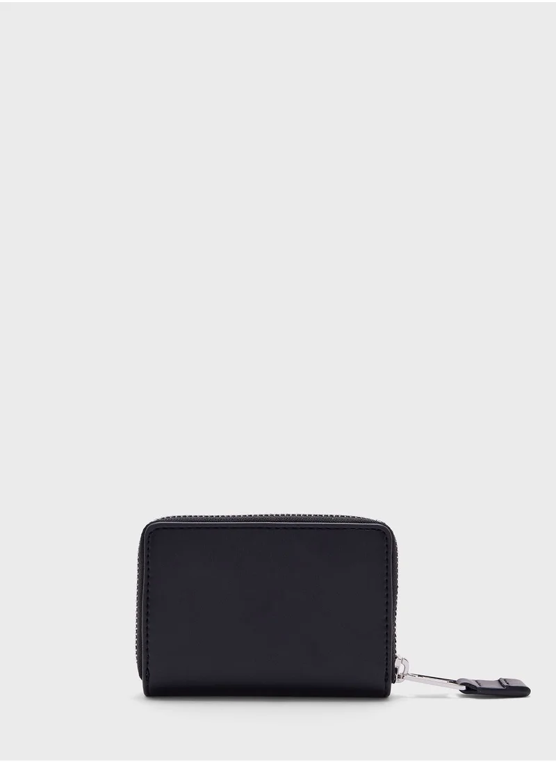 TOMMY JEANS Long Around Zip Wallets