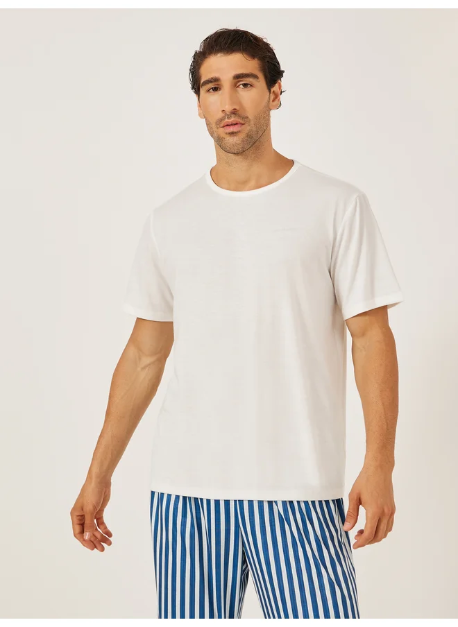 Styli Styli Unwind Minimal Printed T-Shirt and Striped Badge Detail Pyjama Set