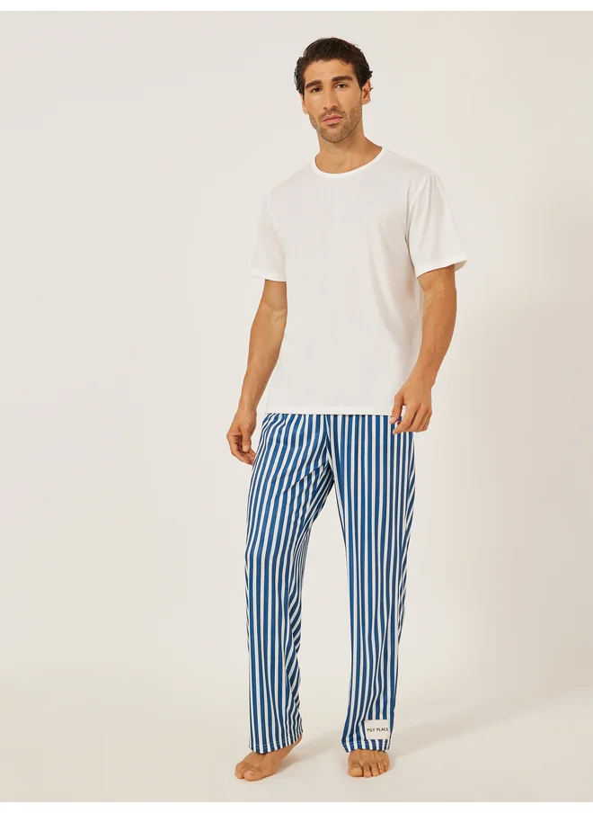 Styli Styli Unwind Minimal Printed T-Shirt and Striped Badge Detail Pyjama Set