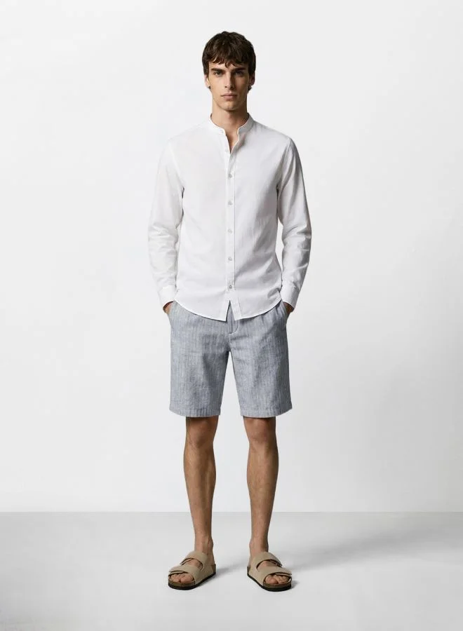 The Indian Garage Co  Men Regular Fit Solid Cross Pocket Mid-Rise Shorts  | Best Price UAE