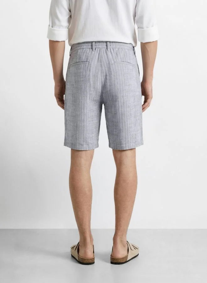 The Indian Garage Co  Men Regular Fit Solid Cross Pocket Mid-Rise Shorts  | Best Price UAE
