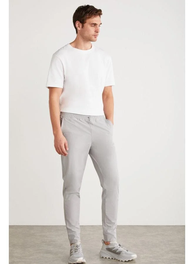 GRIMELANGE Christian Men's Elastic Waist and Stopper Detailed Technical Fabric Grey Sweatpants.