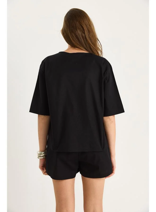 جينجر طقم بلوزة بخصر مربوط وتنورة قصيرة