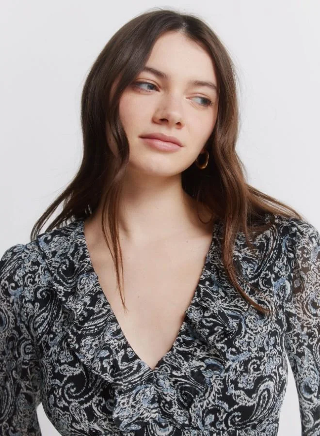 Springfield  Printed long sleeve short dress. V-neck with ruffle. Cut below the bust. Skirt with double flounce. Ruffle detail on cuffs. for Women | Best Price UAE