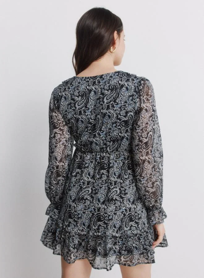 Springfield  Printed long sleeve short dress. V-neck with ruffle. Cut below the bust. Skirt with double flounce. Ruffle detail on cuffs. for Women | Best Price UAE