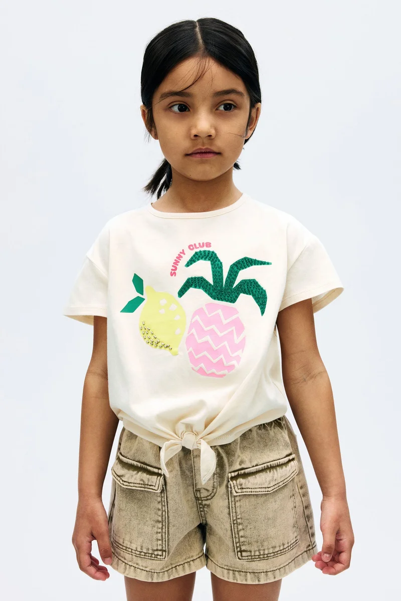 اتش اند ام بلوزة بتفاصيل حبات خرزية