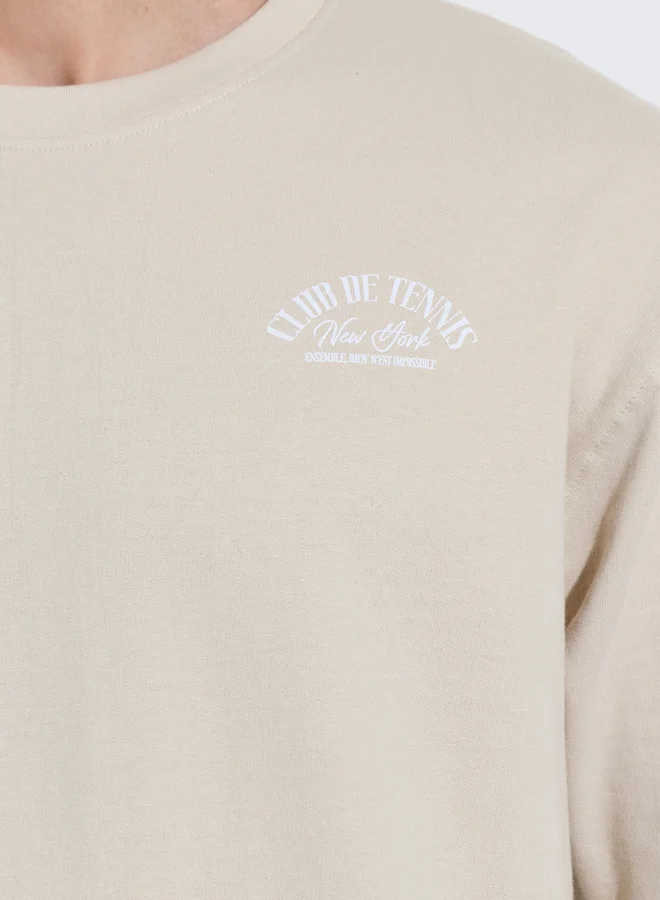 Styli  Men Beige Tennis Graphic Print Oversized T-Shirt for Men | Best Price UAE