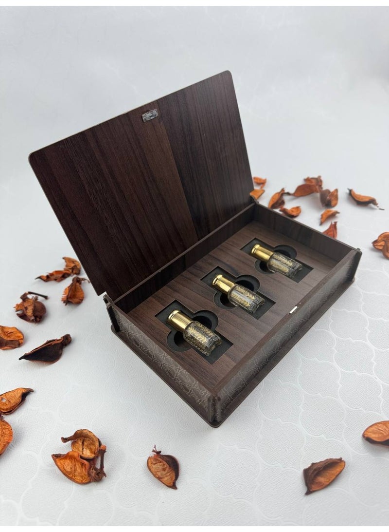 Samrix Touch Box with Samrix:  A wooden box containing 3 quarter-tola bottles of oud oil  ✔ A luxurious Touch Box with an elegant wooden design  ✔ Contains a variety of oud oils  ✔ Suitable for luxury gifts and giveaways ✔ Reflects refined taste and Arabian luxury ✔ An ideal gift for friends and family ✔ Suitable for weddings and engagements ✔ Perfect for high-end corporate gifts ✔ Luxurious packaging, ready for presentation ✔ High-quality materials for durability ✔ Rich and distinctive fragrance ✔ Practical yet elegant design ✔ Adds a touch of luxury to any occasion ✔ Reflects Arabian authenticity and heritage ✔ Suitable for religious and formal occasions ✔ Makes the gift more valuable and distinctive ✔ A sophisticated gift that combines beauty and fragrance ✔ Offers a diverse fragrance experience ✔ A luxurious work of art for display and use - Image 1