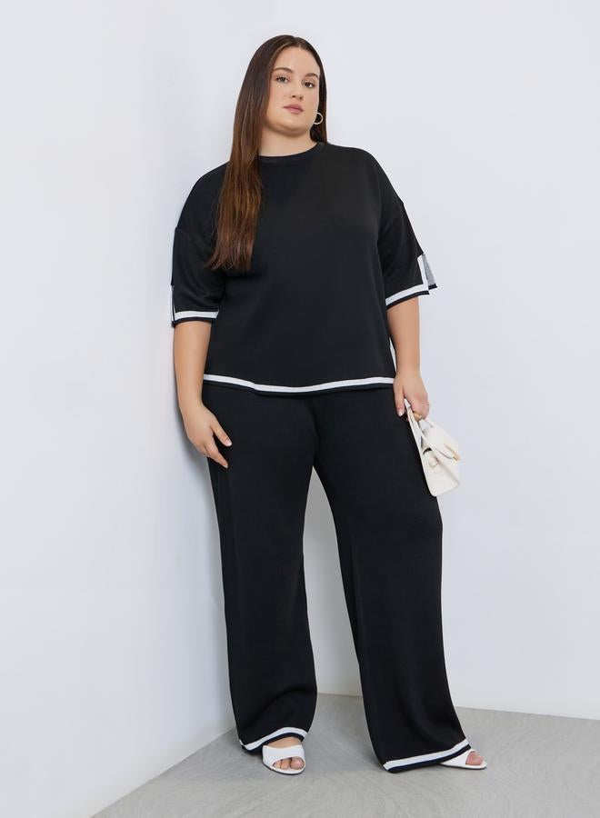 ستايلي بلوزة محبوكة واسعة بتفاصيل متباينة وكتف منخفض - Image 3