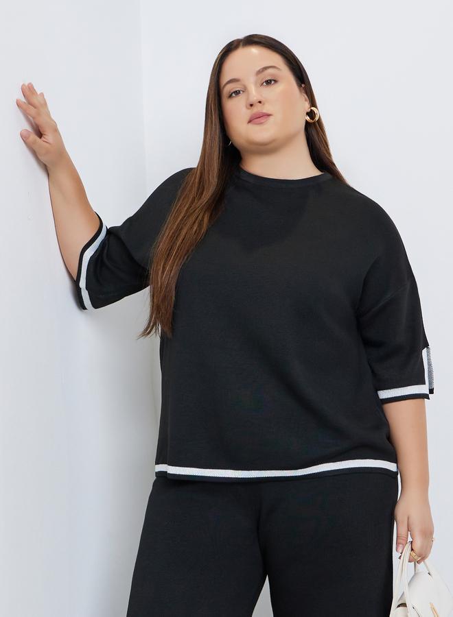 ستايلي بلوزة محبوكة واسعة بتفاصيل متباينة وكتف منخفض - Image 2