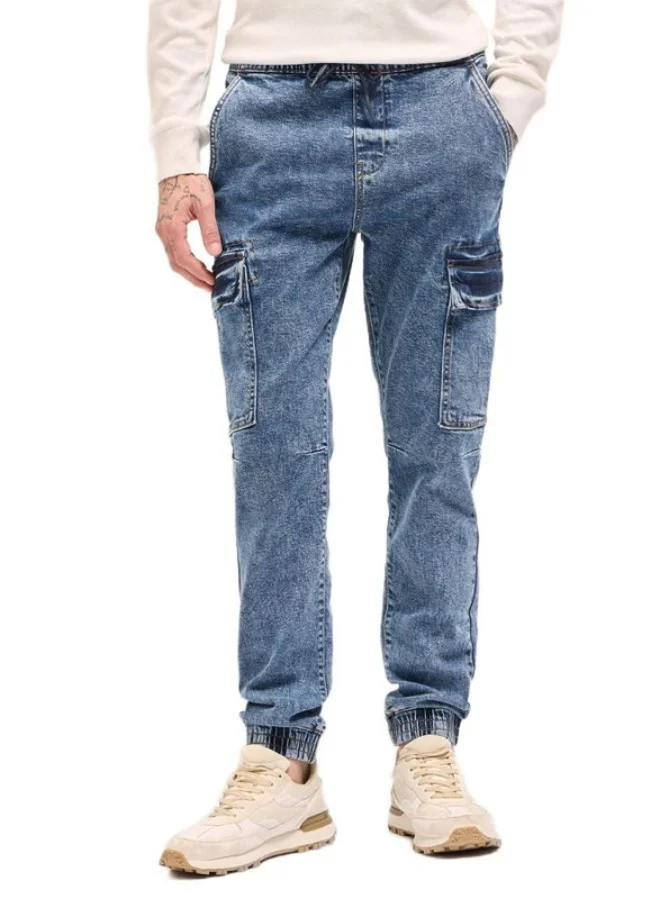 Men's Mid Blue Slim Fit Jogger-Style jean with Cargo Pockets Classic Comfort With Modern Style, Perfect For Everyday Casual Looks And Effortless Streetwear Vibes