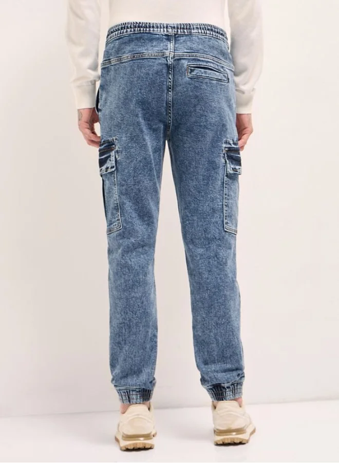 The Bear House  Men's Mid Blue Slim Fit Jogger-Style jean with Cargo Pockets Classic Comfort With Modern Style, Perfect For Everyday Casual Looks And Effortless Streetwear Vibes for Men | Best Price UAE