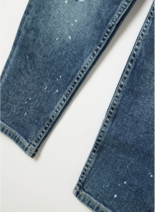 او في اس Five-pocket jeans with abrasions