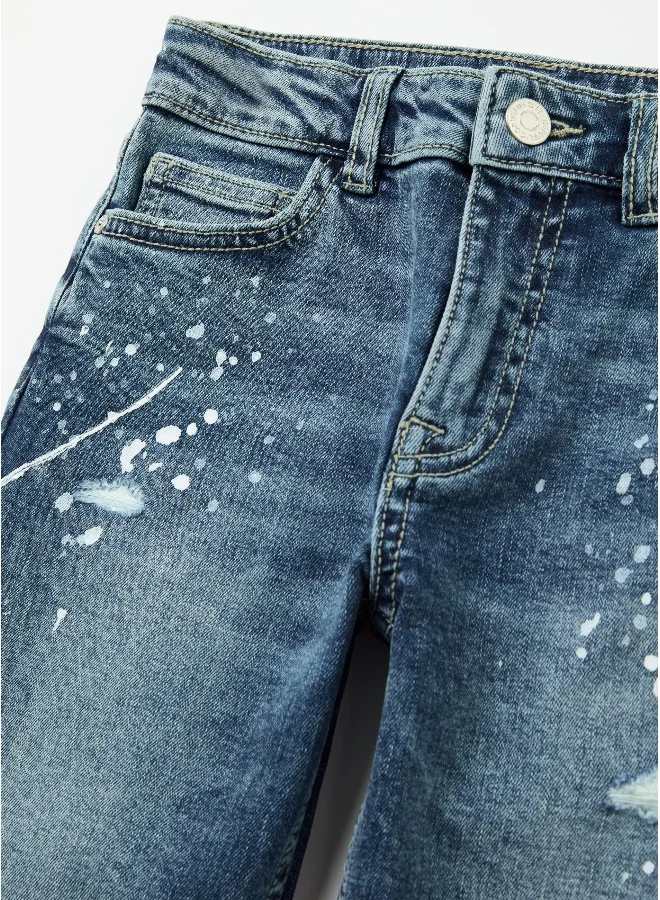 او في اس Five-pocket jeans with abrasions