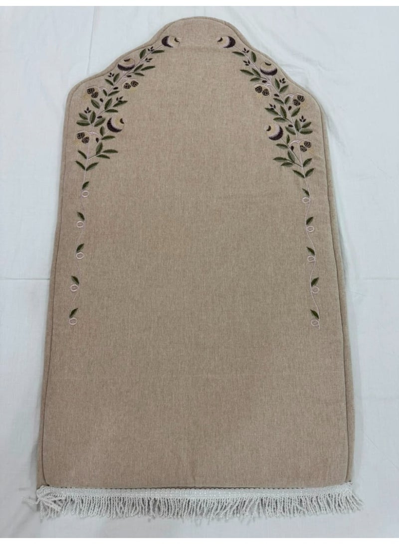 A padded, embroidered prayer rug featuring a classic and elegant *mihrab* design. - Image 1