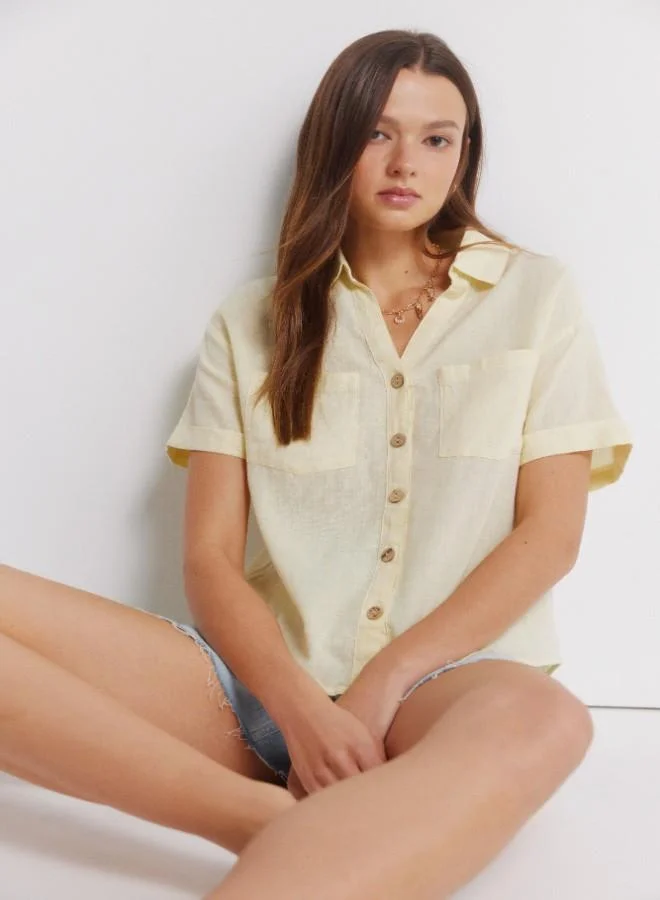 Springfield  Linen shirt. Short folded sleeve. V-neck shirt collar. Front buttons. Patch pockets. for Women | Best Price UAE