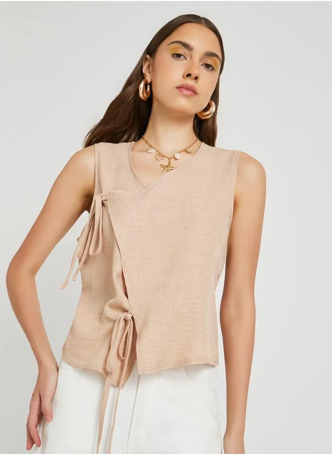 Take Two Take Two Solid Sleeveless Wrap Top with Tie-Up Detail