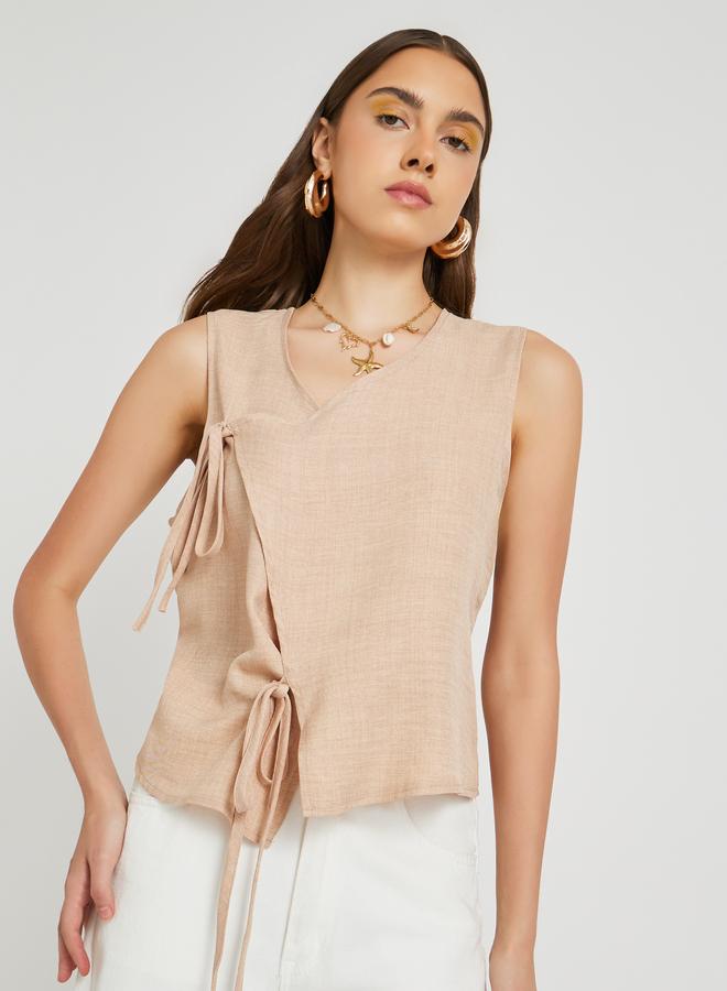 Take Two Solid Sleeveless Wrap Top with Tie-Up Detail - Image 1