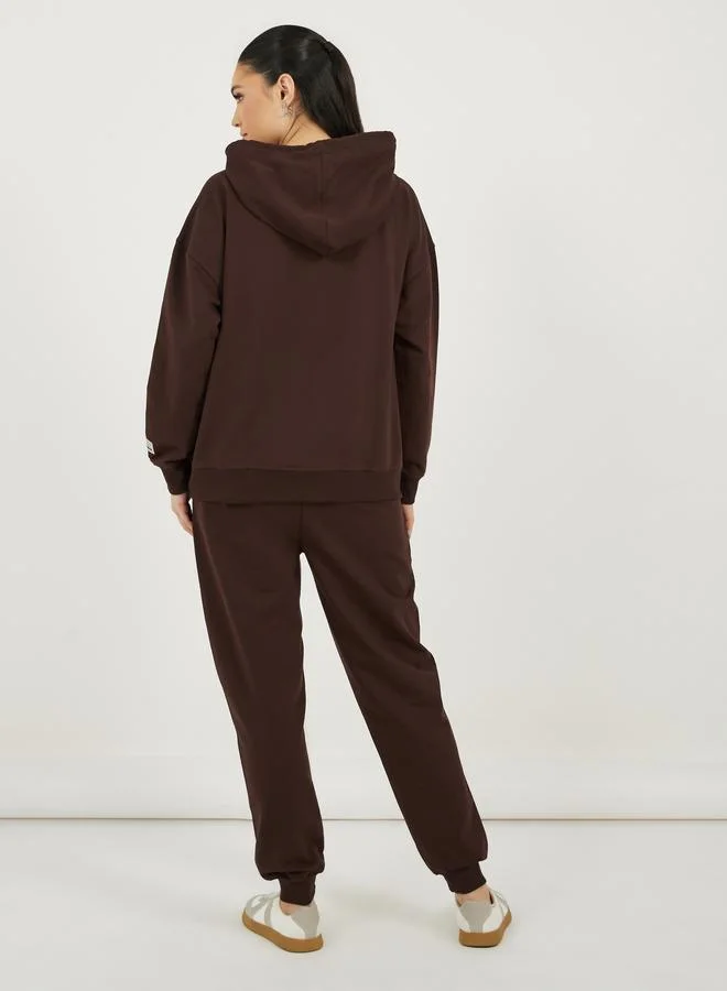 Styli Styli Graphic Print Oversized Hoodie and Cuffed Joggers Co-Ords