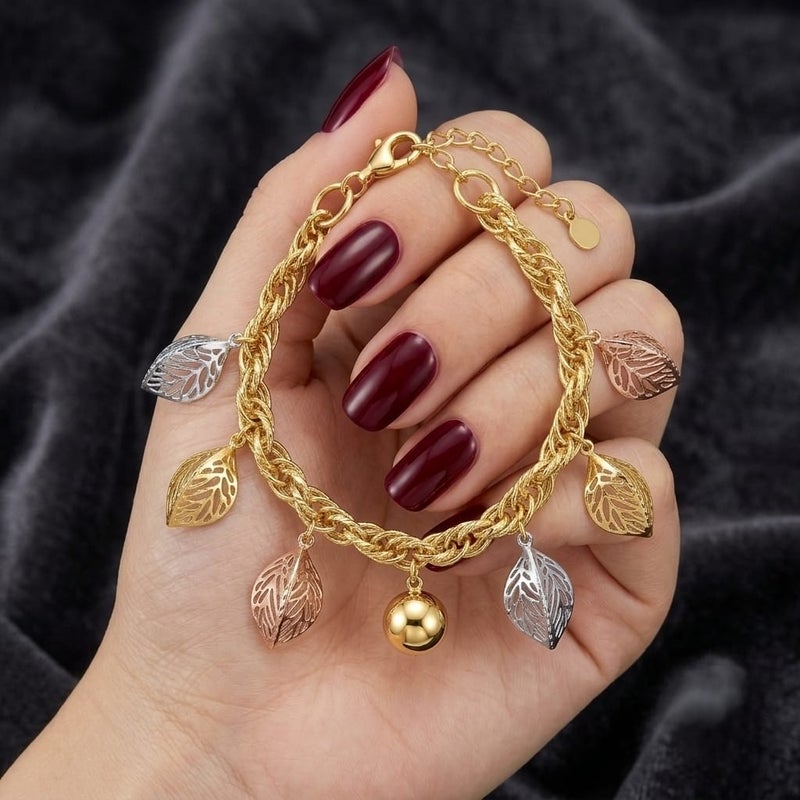 An elegant gold bracelet, with a braided chain and leaf pendants in (silver, rose gold, gold) colors and a shiny gold-colored ball in the middle, with an adjustable clasp to suit you. - Image 5