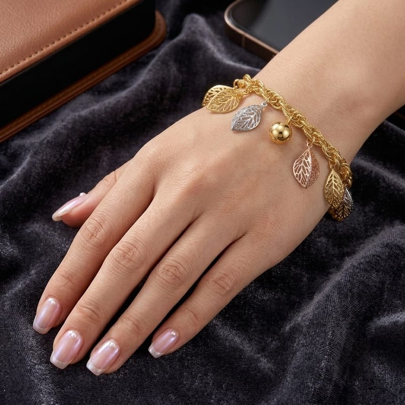 An elegant gold bracelet, with a braided chain and leaf pendants in (silver, rose gold, gold) colors and a shiny gold-colored ball in the middle, with an adjustable clasp to suit you. - Image 3