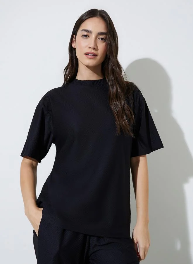 Styli  Black Oversized Textured Round Neck T-Shirt for Women | Best Price UAE