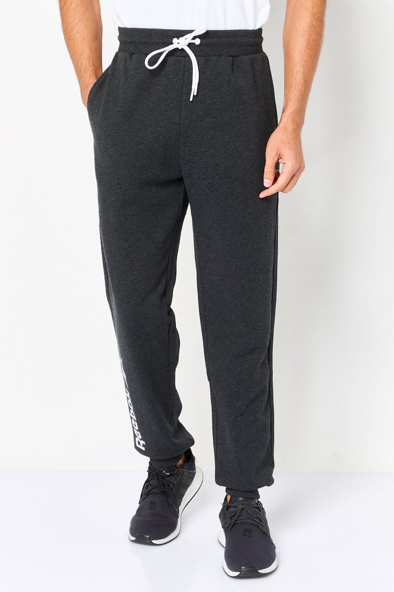 Reebok Men Sportswear Fit Brand Logo Outdoor Sweatpants, Black - Image 1