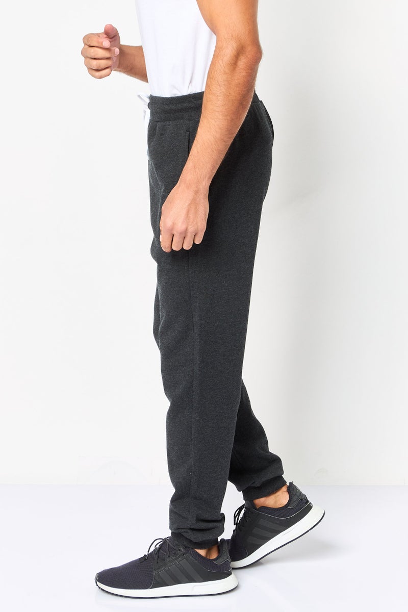 Reebok Men Sportswear Fit Brand Logo Outdoor Sweatpants, Black - Image 4