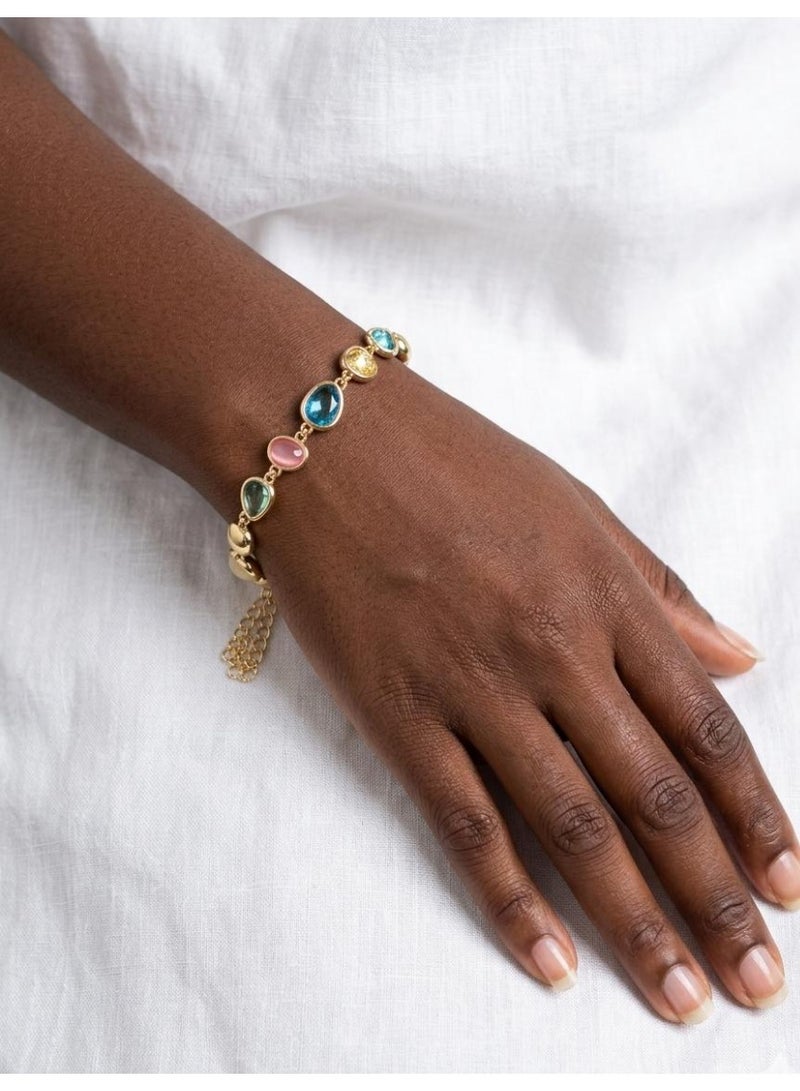 Luxuria An elegant gold bracelet adorned with colorful gemstones in oval and pear shapes, including shades of blue, pink, yellow, and green. - Image 2